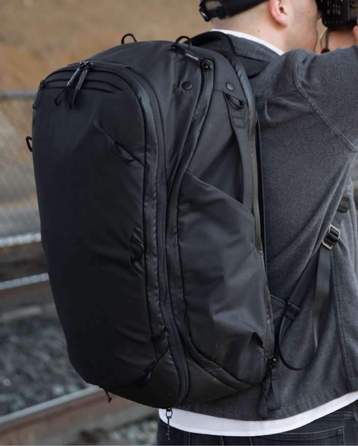 Man Wearing Travel Backpack 45L